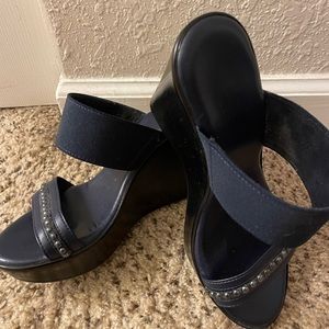 Navy blue 3 inch wedge slip on.